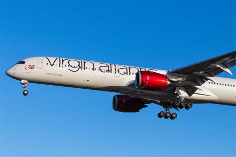 Virgin Atlantic aircraft in front of London terminal, celebrating most improved status