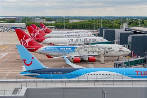 virgin atlantic aircraft parked at manchester airport gate