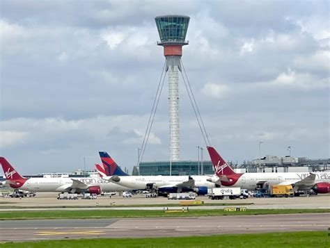 Virgin Atlantic aircraft taxiing with SkyTeam markings at London Heathrow Terminal 3