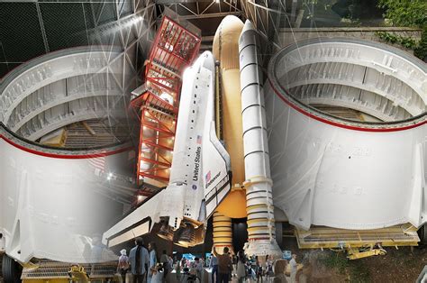 Visitors observing vertical space shuttle Endeavour from multi-level decks