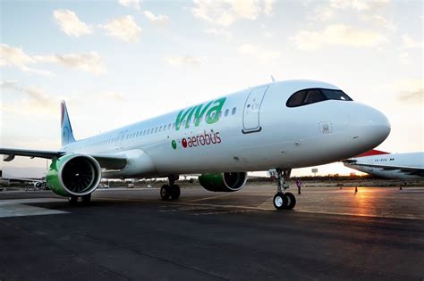 VivaAerobus aircraft with distinctive green and pink livery