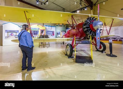 volunteers restoring vintage aircraft inside alaska aviation museum restoration hangar