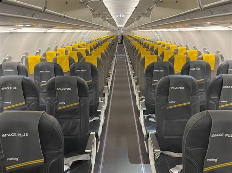vueling flight boarding gate at barcelona with passengers lining up
