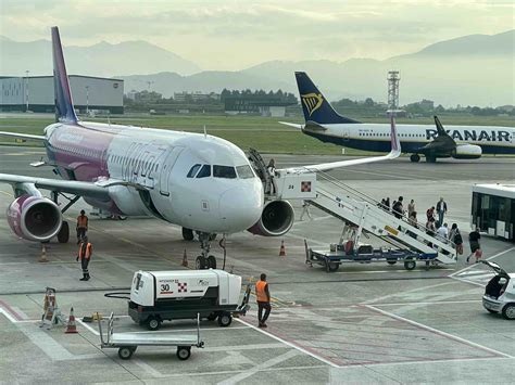 Vueling Wizz Air easyJet Ryanair aircraft at European airport during summer travel delays