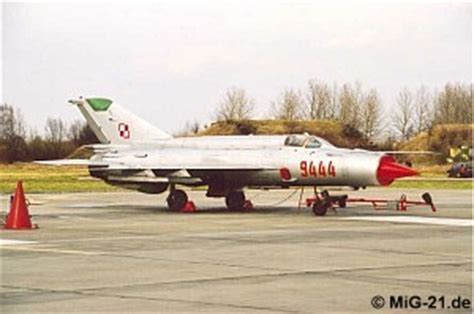 weathered MiG-21 airframe in outdoor aviation museum in Poland