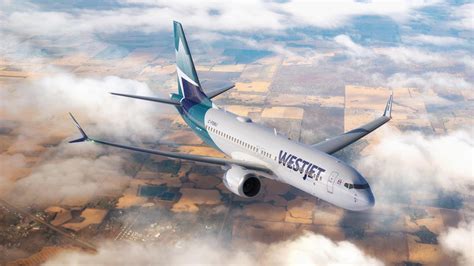 WestJet 737 MAX 8 and Flair aircraft parked side-by-side at Calgary airport