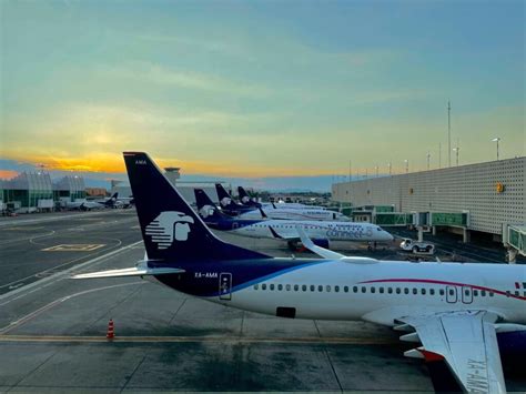 WestJet and Aeromexico executives signing the codeshare expansion agreement