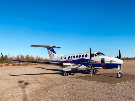 Wheels Up Beechcraft King Air 350 preparing for takeoff from mountain airstrip