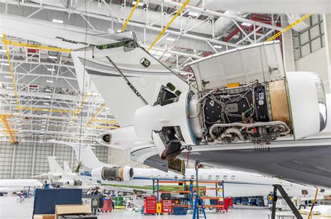 wide-body aircraft undergoing heavy maintenance check in hangar