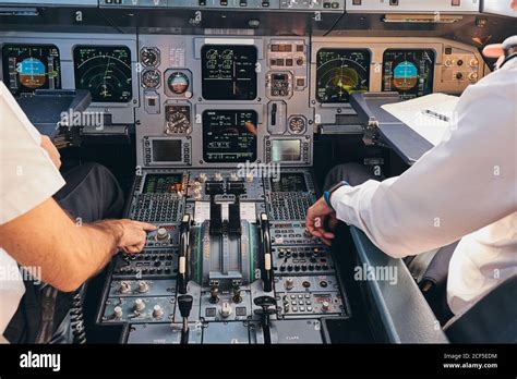 Widebody airline captain in cockpit preparing international flight departure