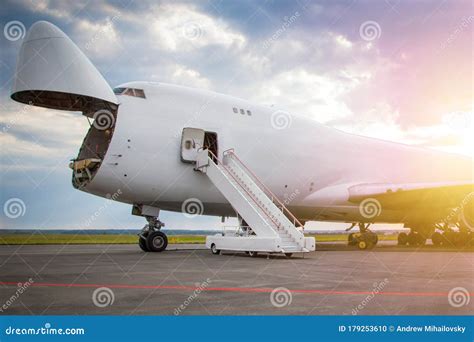 widebody cargo aircraft parked tightly at logistics hub apron with ground equipment