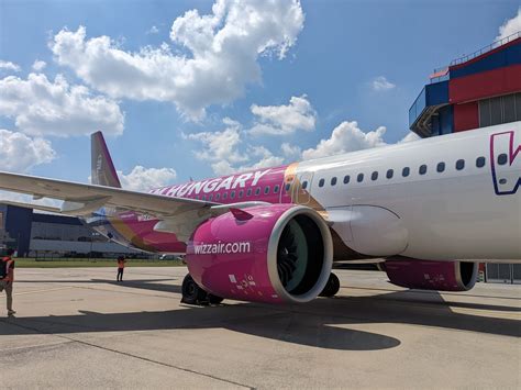 Wizz Air aircraft lined up at Budapest Airport with signature pink livery