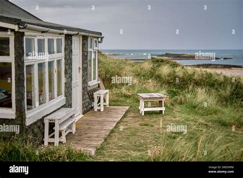 wraparound cottage balcony overlooking green valley in Embleton at sunrise