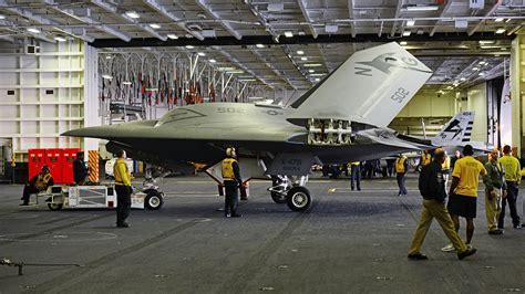 X-47B parked beside MQ-25 prototype at naval test facility