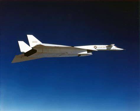 XB-70 Valkyrie white supersonic bomber with drooped wingtips in flight