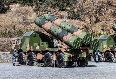 YJ-12B coastal defense missile battery mounted on mobile launch trucks near Chinese shoreline