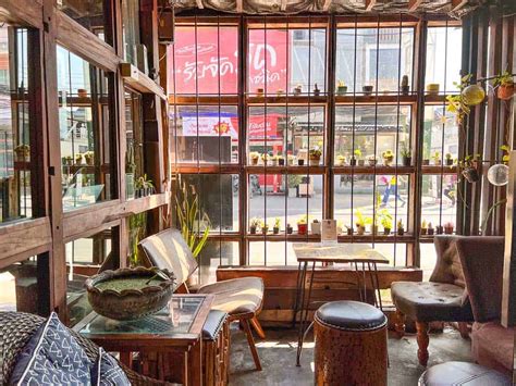Young digital nomad working from a rooftop café in Chiang Mai, Thailand