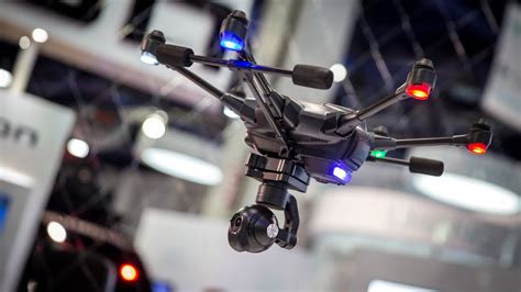Yuneec Typhoon drone with camera rig hovering over industrial site