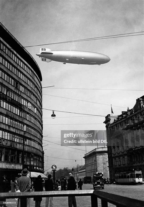 Zeppelin airship flying over Berlin with sunset lighting
