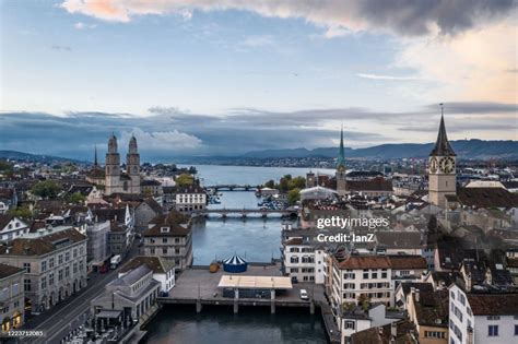 zurich old town river view with swiss flags and historic architecture